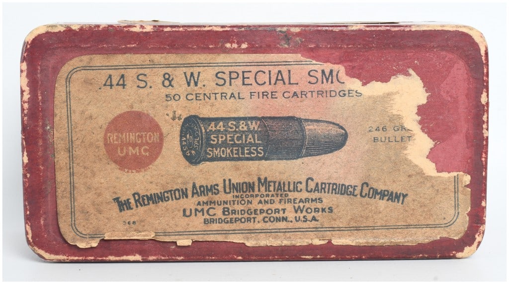 A Lot of 50 Remington UMC .44 S. & W. Special Smokeless Cartridges: This lot features 50 rounds of .44 S. & W. Special centerfire ammunition contained within a vintage two-piece red cardboard box. The cartridges are loaded with 246-grain lead bullets, comprising a mix