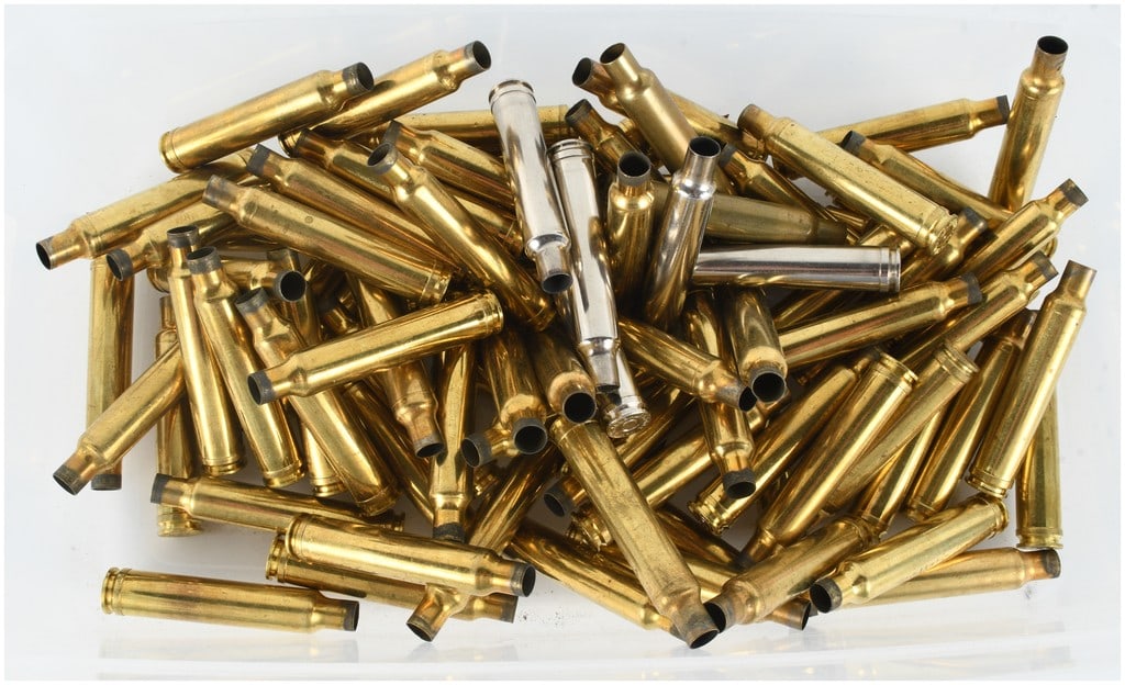 A Lot of 80 Weatherby .300 Weatherby Magnum Empty Brass Casings: This lot consists of 80 empty brass casings for reloading, primarily chambered in .300 Weatherby Magnum. The collection features a majority of standard brass casings with several nickel-plated example
