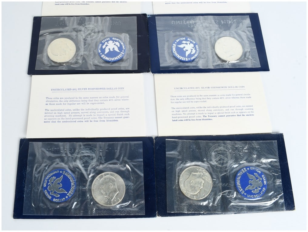 A Set of Four 1971-S US Eisenhower 40% Silver Dollars, Uncirculated Blue Ike Sets: A set of four 1971-S Eisenhower silver dollars, strike type uncirculated, commonly referred to as Blue Ikes. Each coin was produced at the San Francisco Mint and is composed of 40% silver. The obverse