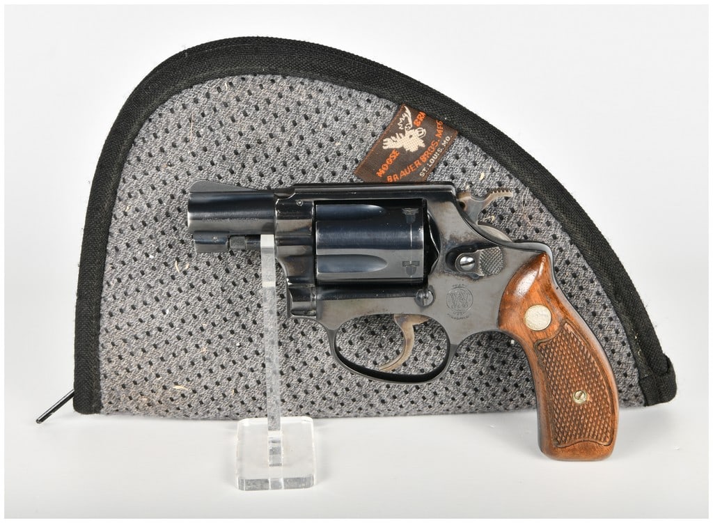 Smith & Wesson Model 36 Double Action Revolver .38 S&W Special with 1.75 Inch Barrel: This Smith & Wesson Model 36 is a double-action revolver chambered in .38 S&W Special and built on the J-frame platform with a five-shot capacity. The firearm features a 1.75-inch barrel with a fixed 