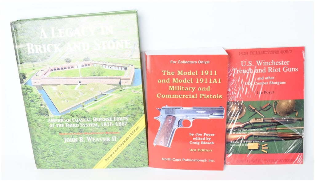 Three Volumes of Military History and Firearms Reference by Weaver II and Poyer (DJ): This collection consists of three reference volumes focusing on American military fortifications and small arms. The group includes one deluxe hardcover and two specialized softcover collector's manua