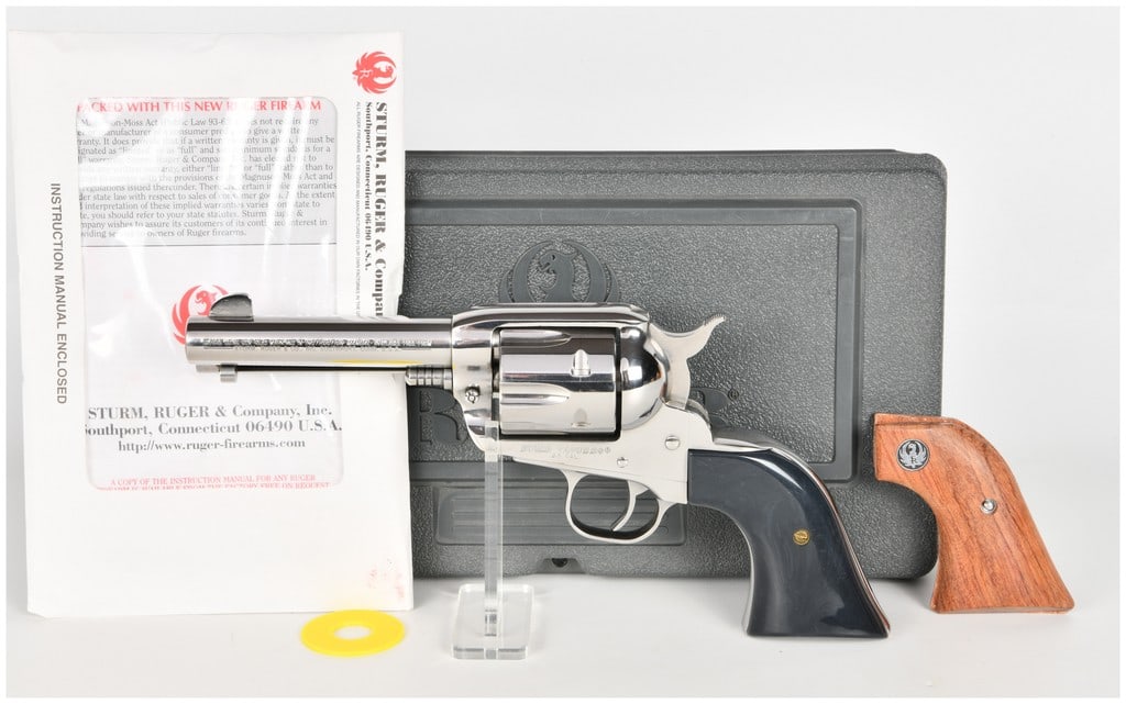 Ruger Vaquero Single Action Revolver .45 Colt with 4.62 Inch Barrel: This Ruger Vaquero is a single-action revolver chambered in .45 Colt featuring a 4.62-inch barrel and a high-polish stainless steel finish. The firearm is currently fitted with smooth dark gray and bl