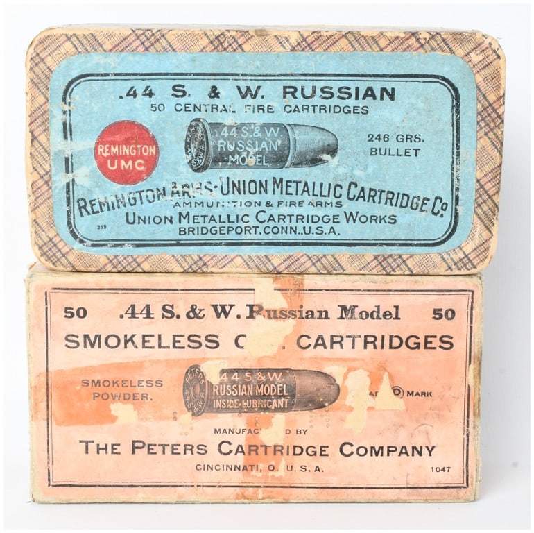 A Lot of 45 Remington and Peters .44 S&W Russian Cartridges: This lot consists of a total of 45 vintage cartridges of .44 S&W Russian caliber contained within two period original boxes. The first box features a blue label on plaid-patterned cardboard and was ma