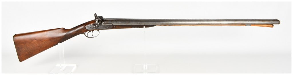W. & C. Scott & Son Side-by-Side Muzzleloading Percussion Shotgun Antique: This W. & C. Scott & Son side-by-side muzzleloading percussion shotgun is configured with twin barrels and a central top rib. The action utilizes dual external hammers and double triggers, featuring d