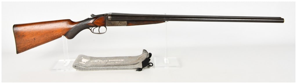 Belgian Deluxe Model Side-by-Side Break Action Shotgun 12 Gauge: This lot consists of a single Belgian side-by-side break-action shotgun chambered for 12-gauge shells with 65mm chambers. The firearm is a hammerless design featuring long barrels with a raised textur