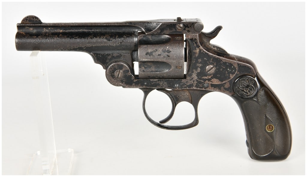Smith & Wesson .38 Double Action 4th Model Revolver .38 S&W with 3.25 Inch Barrel Antique: This is a top-break, double-action revolver chambered in .38 S&W, specifically identified as a Smith & Wesson .38 Double Action 4th Model. The firearm features a five-shot cylinder and a barrel with a