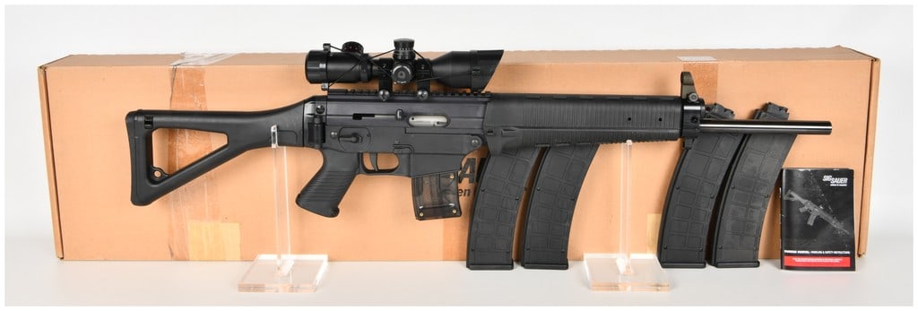 Sig Sauer SIG522 Semi-Automatic Rifle .22 LR with 20 Inch Barrel: This Sig Sauer SIG522 is a semi-automatic sporting rifle chambered in .22 LR and configured with a 20-inch heavy barrel. The rifle features a matte black finish on the metal components and is fitted w