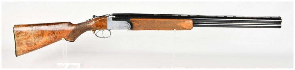 Davide Pedersoli Mod. 170 Over-Under Shotgun 12 Gauge with 26 Inch Barrel 1959: This is an Italian-manufactured Davide Pedersoli Model 170 over-under shotgun chambered for 12 gauge, designed as a field-grade sporting firearm. The 26-inch blued barrel set features a ventilated top