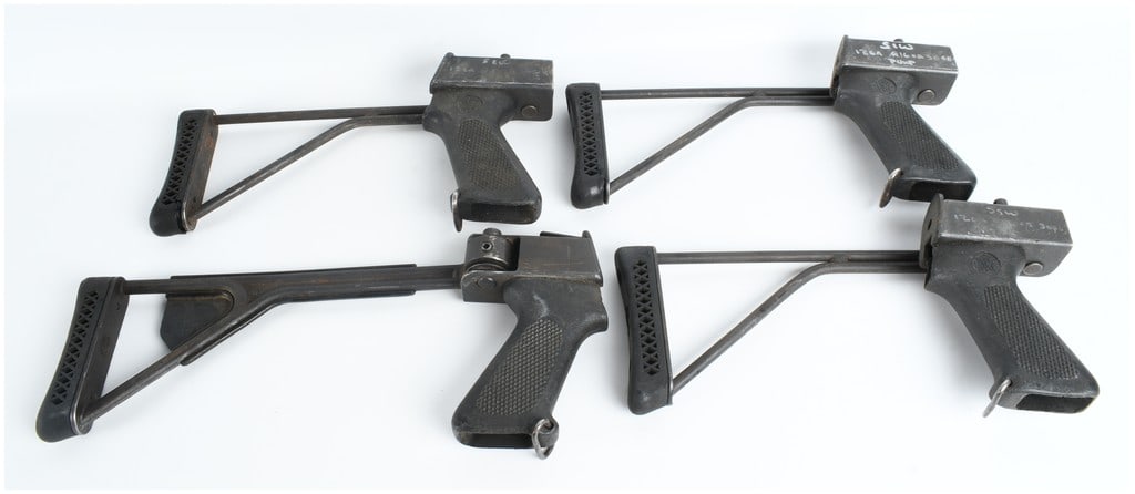 A Collection of 4 Smith & Wesson Model 3000 Pump Action Shotgun 12 Gauge Folding Stocks: This lot consists of a collection of four side-folding stock assemblies with integrated pistol grips designed for the Smith & Wesson Model 3000 12-gauge pump-action shotgun. Each assembly features a s