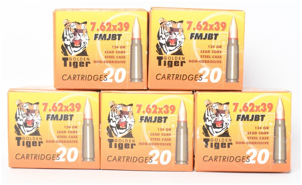 A Lot of 100 Rounds of Golden Tiger 7.62x39mm FMJBT Ammunition: This lot consists of 100 rounds of 7.62x39mm rifle ammunition, organized into five individual 20-round boxes. The cartridges feature 124-grain lead-core full metal jacket boat tail (FMJBT) projectiles