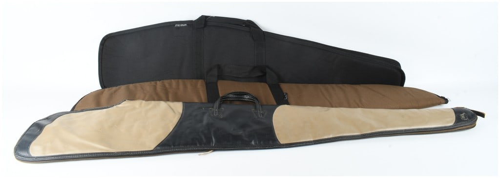 A Collection of 3 Gun Cases and Slips Including Plano and Boyt Models: This lot consists of a collection of three gun cases intended for the transport and protection of rifles or shotguns. The grouping features one hard-sided case and two soft-sided slips. The hard-sided
