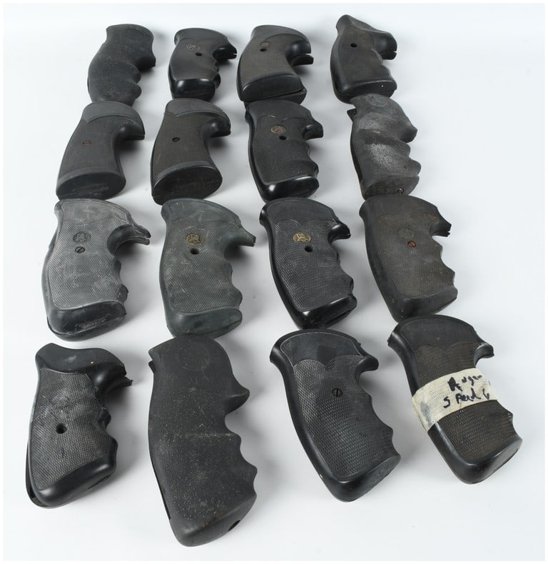 A Collection of 16 Assorted Rubber and Polymer Revolver Grips Including Pachmayr and Hogue Styles: This lot consists of 16 assorted black textured rubber and polymer pistol grips, primarily designed for use with various revolver frames. The collection includes a mix of styles, including one-piece w