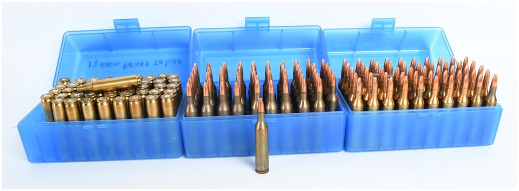 A Lot of 101 Live Rounds and 45 Primed Casings Nosler .17 Remington Ammunition: This lot comprises a collection of .17 Remington caliber ammunition and components organized within three blue plastic hinged-lid storage cases. The group includes 101 live cartridges and 45 empty pri