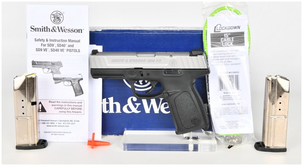 Smith & Wesson SD9 VE Semi-Automatic Pistol 9mm with 4 Inch Barrel: This Smith & Wesson SD9 VE is a semi-automatic pistol chambered in 9mm, featuring a 4 inch barrel and a distinct two-tone aesthetic. The firearm is constructed with a stainless-finish steel slide and 