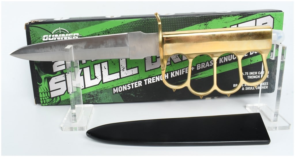 Gunner Gear 2 in 1 Skull Crusher US Model 1918 Reproduction Trench Knife: This is a modern reproduction of a US Model 1918 Mark I trench knife, manufactured by Gunner Gear and marketed as the 2 in 1 Skull Crusher. The knife features an approximately 6.75-inch double-edged c