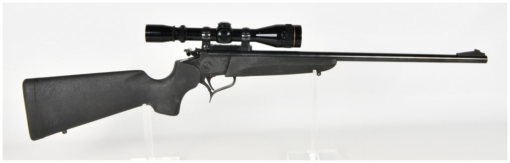 Thompson/Center Arms Contender Single Shot Break Action Rifle .22 Hornet with 21 Inch Barrel: This Thompson/Center Arms Contender is a single-shot break-action rifle chambered in .22 Hornet. The firearm features a 21-inch blued barrel equipped with a ramped front sight and an adjustable rear l