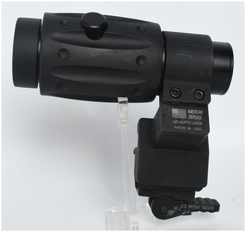 Primary Arms 3X Tactical Magnifier with American Defense AD-170-S Quick Detach Mount: One tactical magnifier optic mounted on a quick-detach riser mount, designed to provide 3x magnification when paired with a red dot or holographic sight. The optic features a black rubberized armored 