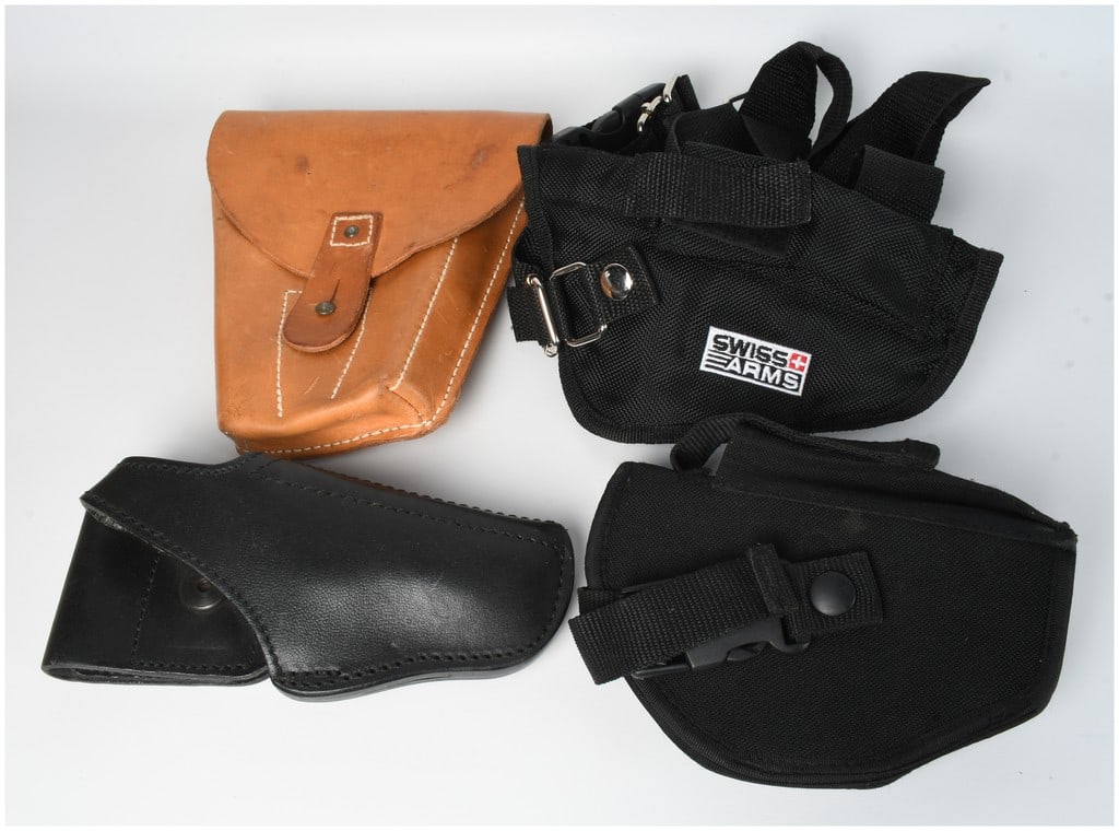 A Collection of 4 Assorted Leather and Nylon Pistol Holsters: This lot consists of a collection of 4 assorted pistol holsters of various materials and styles intended for several handgun types. Included is a vintage-style brown leather full-flap CZ 82 holster wi