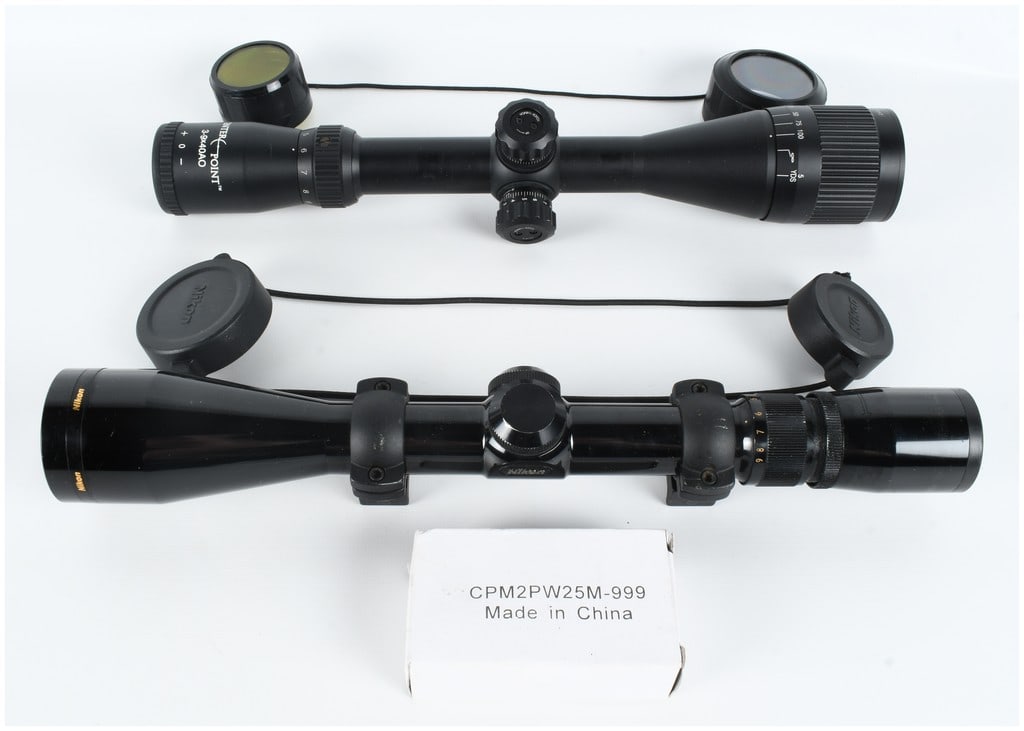 A Pair of Variable Power 3-9x40mm Rifle Scopes by Nikon and Center Point: This lot features a pair of variable-power 3-9x40mm rifle scopes, consisting of one Center Point model and one Nikon model, along with a small accessory box. The first optic is a Center Point 3-9x40AO