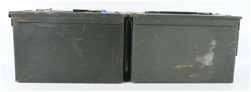 Two US Military M2A1 Steel Ammunition Cans: This lot consists of two US military M2A1 steel ammunition storage containers, which were standard issue for transporting .50 caliber machine gun ammunition and other ordnance. Each container is const