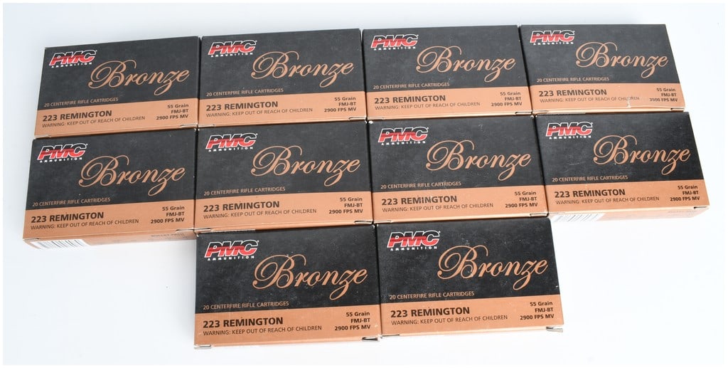 A Lot of 200 Rounds of PMC Bronze .223 Remington 55 Grain FMJ-BT Ammunition: This lot consists of 200 rounds of PMC Ammunition Bronze series .223 Remington centerfire rifle cartridges, distributed across 10 factory boxes containing 20 rounds each. Each cartridge is loaded with
