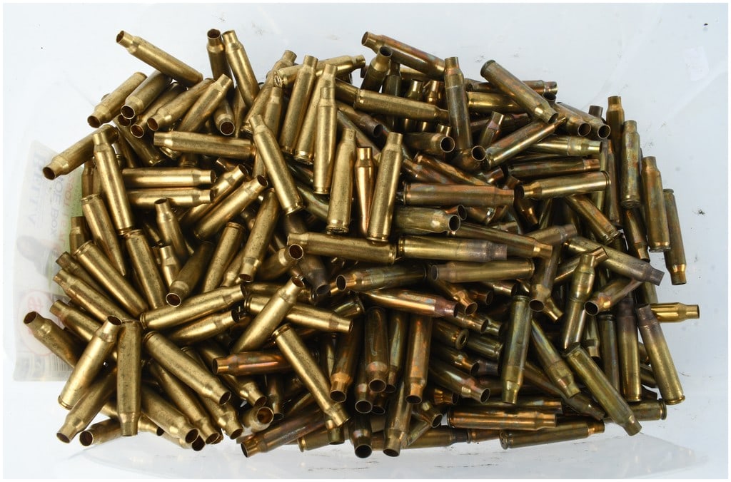 A Collection of 400 Once Fired .223 Rem and 5.56mm Brass Shell Casings: This collection consists of 400 once fired brass shell casings, primarily composed of .223 Rem and 5.56x45mm NATO calibers. The bottlenecked casings feature various manufacturer markings on the headst
