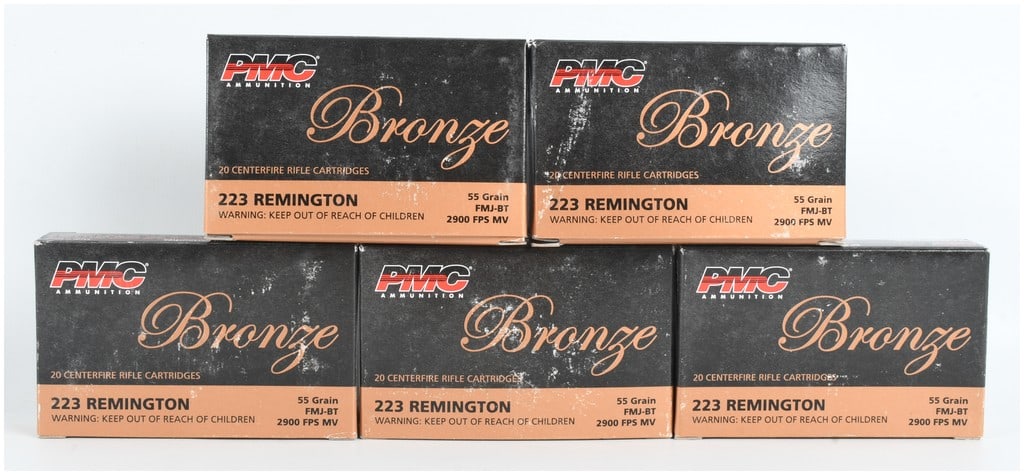 A Lot of 100 PMC Bronze Centerfire Ammunition .223 Remington 55 Grain FMJ-BT: This lot consists of a total of 100 rounds of PMC Bronze .223 Remington centerfire rifle ammunition, contained within five individual commercial boxes of 20 rounds each. These cartridges are loaded wi