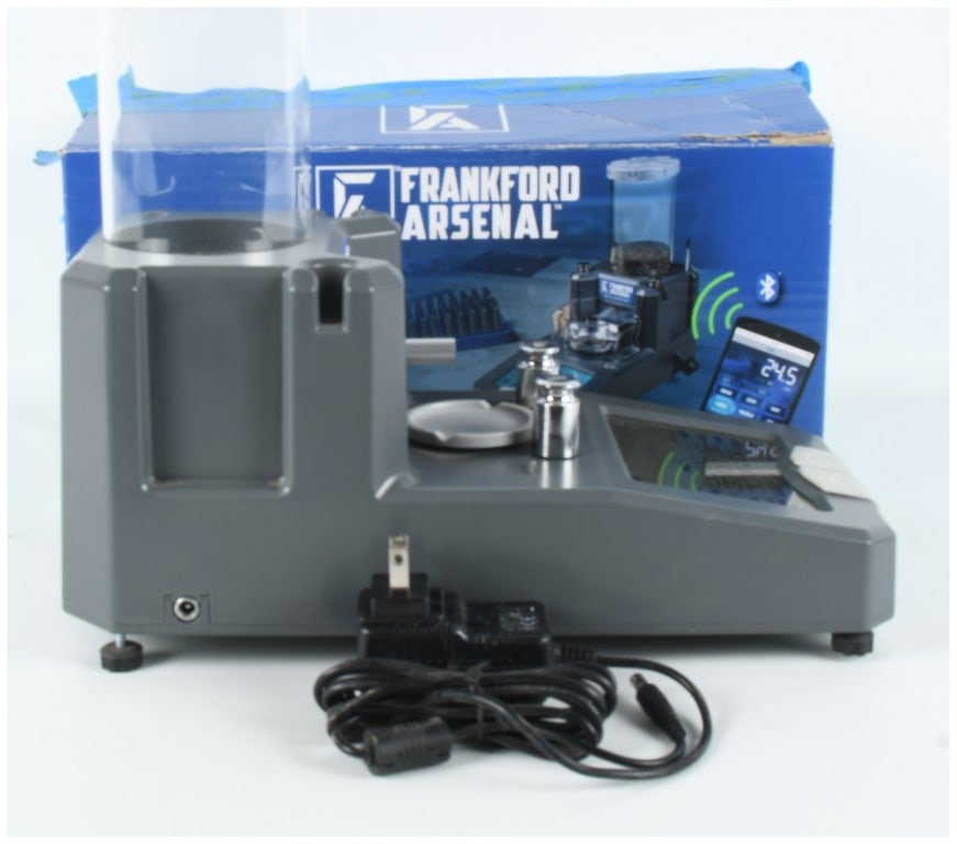 Frankford Arsenal Intellidropper Electronic Powder Measure: This lot consists of a Frankford Arsenal Intellidropper electronic powder measure and scale, an instrument designed for precision ammunition reloading. The device features a gray plastic body with an 