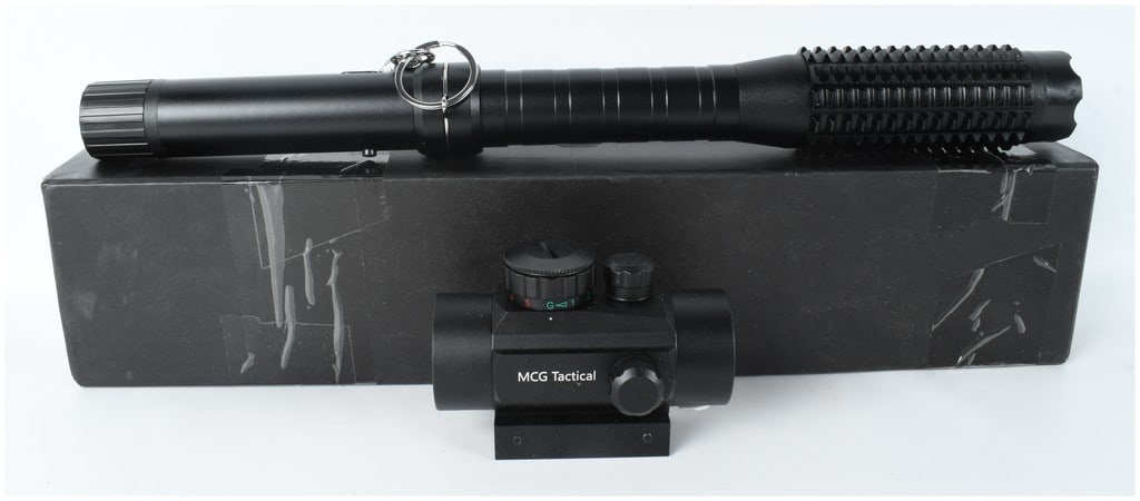 A Group of Two Tactical Accessories Including an MCG Tactical Red Dot Sight and a Stun Baton: This lot consists of two tactical accessories including a tactical flashlight and stun baton combination and a compact red and green dot sight. The tactical baton is constructed of black anodized alum