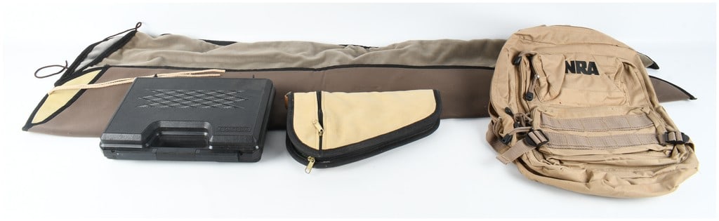 A Collection of Shooting Accessories and Firearm Cases including an NRA Tactical Backpack: This lot contains a group of firearm storage and range accessories. The primary item is a tan nylon tactical-style backpack featuring black embroidered NRA lettering on the upper front pocket, multipl