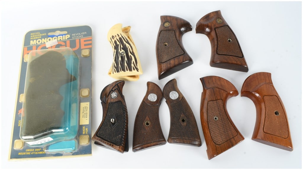 A Collection of 6 Revolver Grips and Stocks Including Smith and Wesson and Hogue: This lot consists of a collection of six revolver grip sets featuring a variety of materials and fits for different manufacturers. Included is a single Hogue Monogrip recoil-absorbing rubber stock in 
