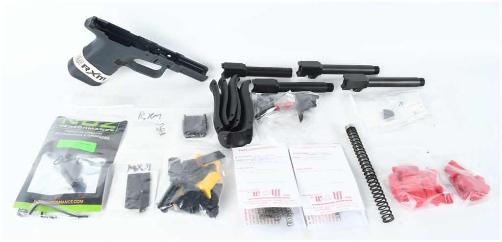 Ruger Max-9 Semi-Automatic Stripped Pistol Frame and Barrels 9mm: This lot consists of a collection of semi-automatic pistol components and accessories primarily centered around the Ruger Max-9 platform chambered in 9mm. The main component is one stripped polymer pi