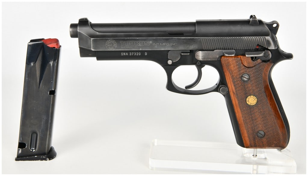 Taurus PT 100 AF Semi-Automatic Pistol .40 S&W with 5 Inch Barrel: This lot features one Taurus model PT 100 AF semi-automatic pistol chambered in .40 S&W, featuring an open-top slide and an alloy frame. The handgun is equipped with a 5-inch barrel and fixed three-do