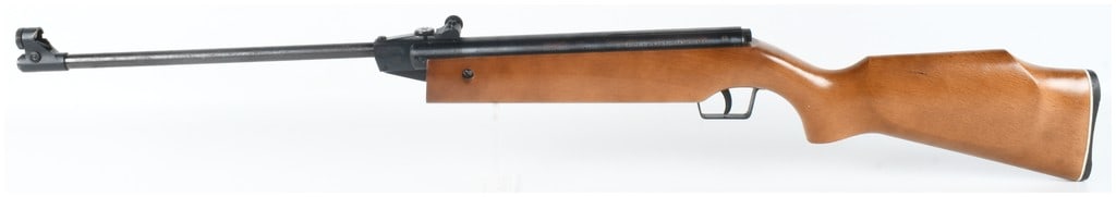 Crosman Model 3100 Break Barrel Air Rifle .177 Caliber: This Crosman Model 3100 is a break barrel air rifle chambered for .177 caliber pellets. The rifle features a blued finish on the metal components and is fitted with a Monte Carlo style wood stock incl