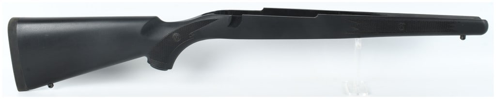 Ruger M77 Long Action Synthetic Rifle Stock: This is a new Ruger M77 long action synthetic rifle stock constructed from black polymer. The stock features a textured finish with checkered panels on the forend and pistol grip for improved handling