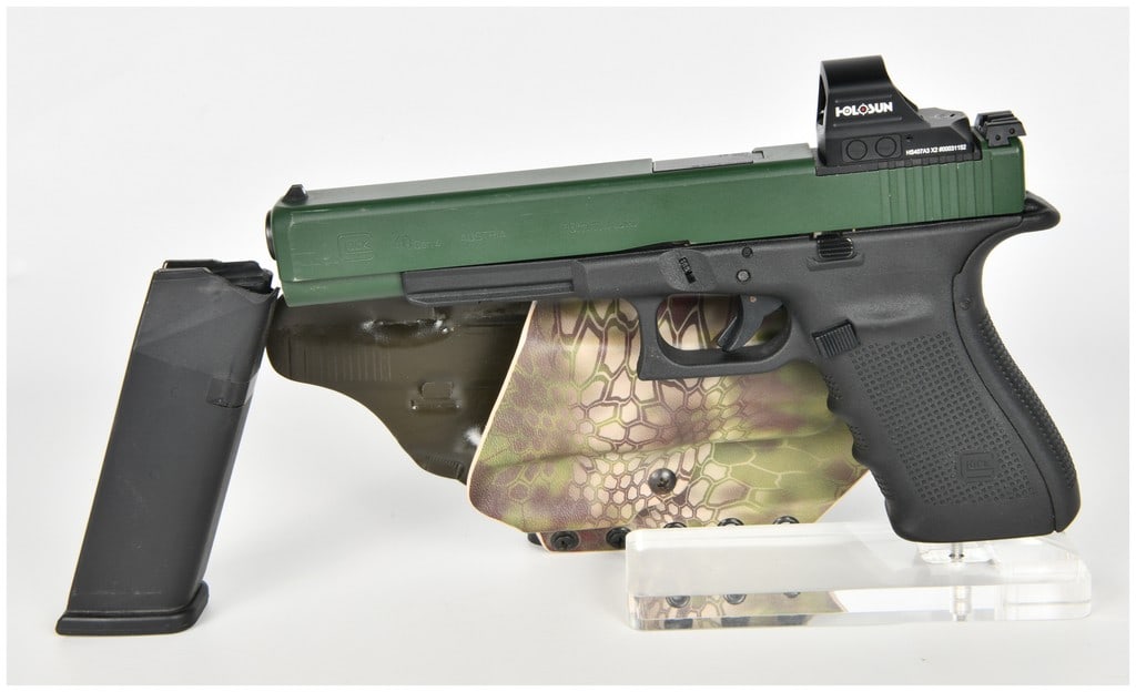 Glock 40 Gen 4 Semi-Automatic Pistol 10mm Auto with 6.02 Inch Barrel: A Glock Model 40 Gen 4 semi-automatic pistol chambered in 10mm Auto, configured as a long-slide firearm suitable for competition or hunting. The pistol features a 6.02-inch barrel housed within a slid