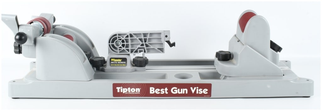 Tipton Best Gun Vise with Wheeler Engineering Delta Series AR-15 Mag Well Vise Block: The Tipton Best Gun Vise is a modular maintenance stand designed for gun cleaning and gunsmithing tasks across a wide range of firearm platforms. The unit is built upon a gray polymer base featuring