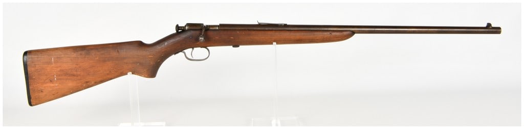 Winchester Model 60 Bolt Action Rifle .22 Short Long and Long Rifle with 23 Inch Barrel: This Winchester Model 60 is a single-shot bolt-action rifle chambered for .22 Short, Long, and Long Rifle cartridges. The firearm features a 23-inch round barrel equipped with a fixed front blade sigh