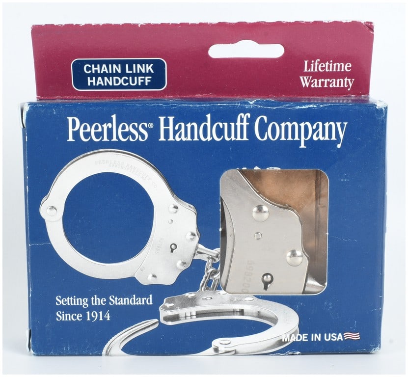 Peerless Handcuff Company Model 700C Chain Link Handcuffs with Original Box: A set of professional grade Model 700C chain link handcuffs manufactured by the Peerless Handcuff Company of Springfield, Massachusetts. The handcuffs are constructed from nickel-plated steel and