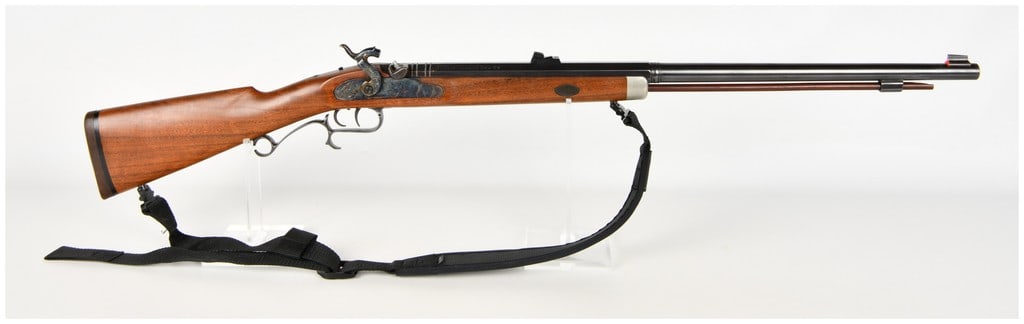 Thompson/Center Arms New Englander Percussion Muzzleloading Rifle .54 Caliber with Octagonal to: This is a Thompson/Center Arms New Englander percussion muzzleloading rifle chambered in .54 caliber designed for sporting use. The blued barrel features a profile that transitions from an octagonal
