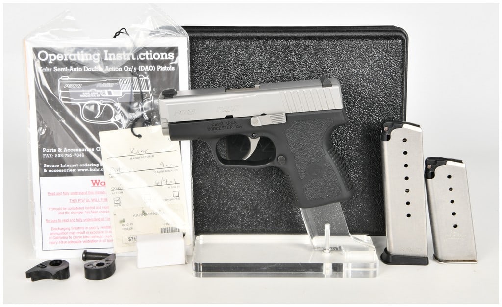 Kahr Arms PM9 Semi-Automatic Pistol 9mm with 3.1 Inch Barrel: This lot features a Kahr Arms PM9 semi-automatic subcompact pistol chambered in 9mm, designed for concealed carry. It features a 3.1-inch barrel and is configured with a two-tone aesthetic consisting 