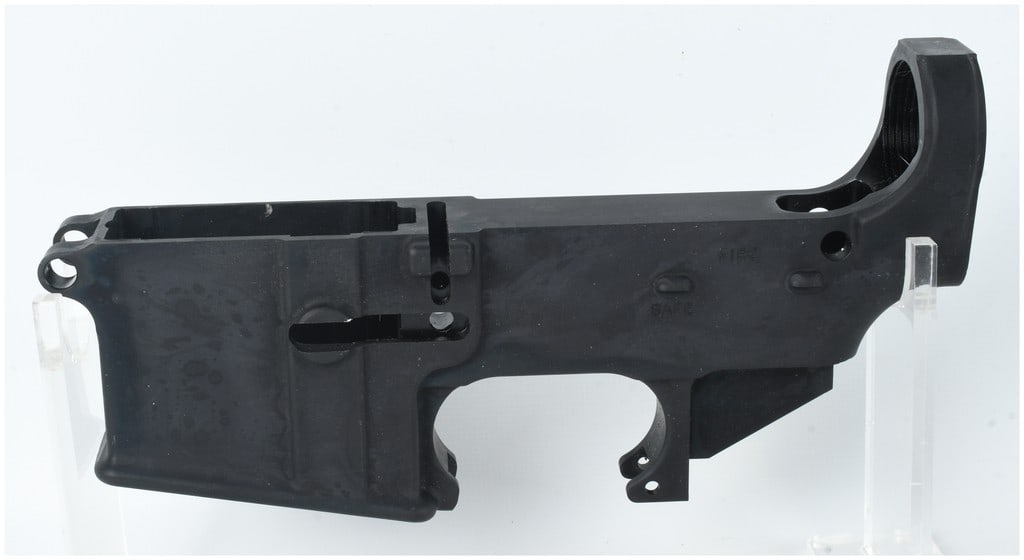 Two Matrix Arms AR-15 80% Lower Receivers: A pair of Matrix Arms AR-15 80% lower receivers constructed from metal with a matte black anodized finish. These components are presented in a non-serialized and unmachined state, with the internal fi
