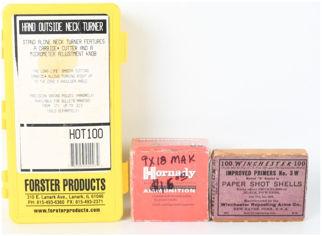 A Trio of Shooting Items Including a Forster HOT100 Neck Turner, Hornady 9x18mm Makarov Ammunition,: This lot consists of three items for shooting and reloading, including a hand outside neck turner, twenty-five rounds of 9x18mm Makarov ammunition, and a box of Winchester primers for paper shot shell
