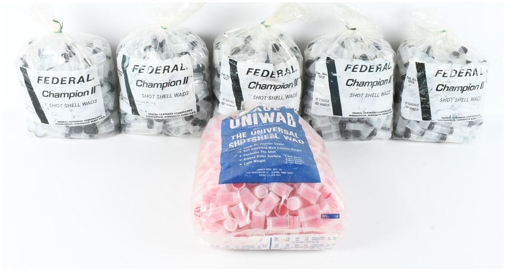 A Lot of 6 Bags of Federal Champion II and Lage Uniwad 12 Gauge Shotgun Shell Wads: This lot consists of six bags of plastic shotgun shell wads designed for reloading 12 gauge ammunition. The collection includes five bags of Federal Champion II shot shell wads, each featuring a