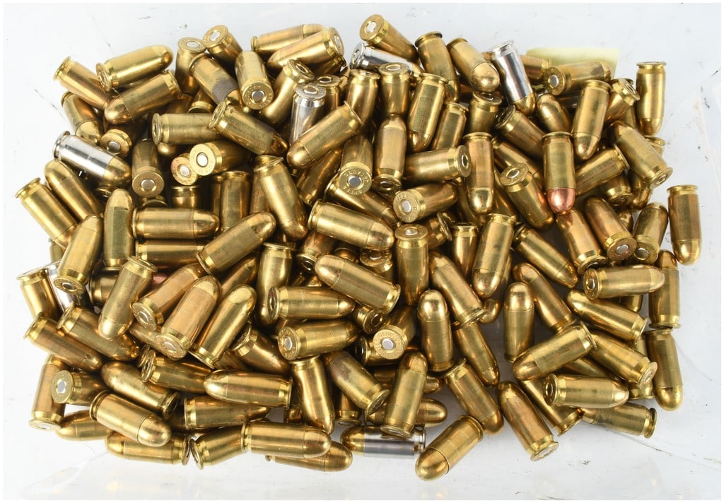 A Lot of 250 Mixed .45 ACP Handgun Cartridges: This lot consists of 250 rounds of mixed .45 Auto (.45 ACP) handgun ammunition, stored loose in a bulk configuration. The collection includes a variety of manufacturers with clearly legible