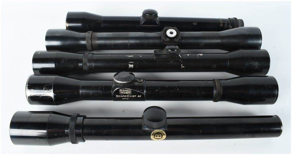 A Collection of 5 Fixed-Power Rifle Scopes: This lot consists of a collection of five vintage fixed-magnification rifle scopes, all featuring gloss black finishes and 4x magnification. The first scope is marked MARBLES 4X on the tube near the e