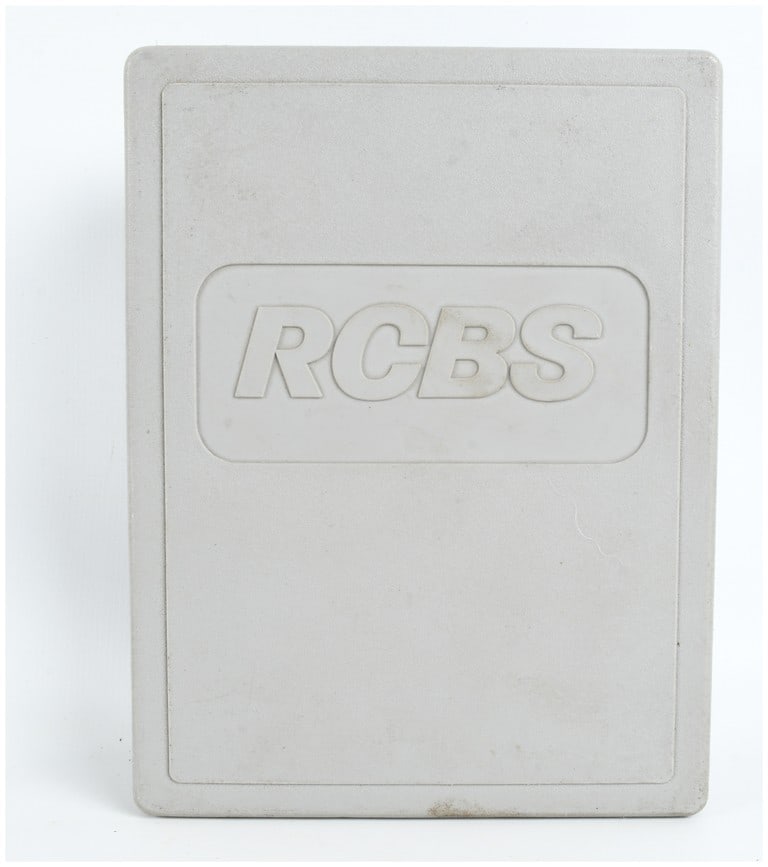 One RCBS 3-Die Carbide Taper Crimp Set for .45 ACP/AR/GAP: A reloading die set manufactured by RCBS, specifically the 3-Die Carbide Taper Crimp Set for .45 ACP, .45 Auto Rim, and .45 GAP cartridges. The set is housed in a gray plastic RCBS storage box with a 