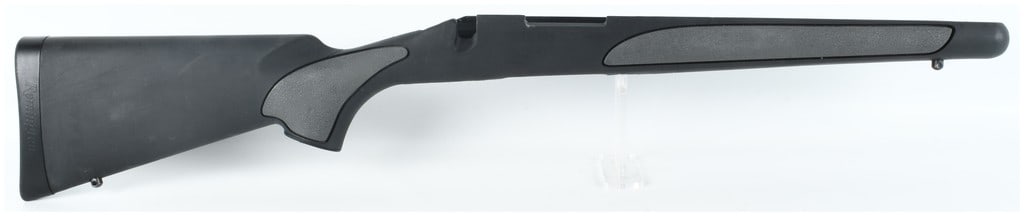 Remington 700 SPS Short Action Synthetic Rifle Stock: A factory original Remington 700 Special Purpose Synthetic (SPS) short action rifle stock, appearing as a new take off component. The right-handed stock is manufactured from black polymer and features