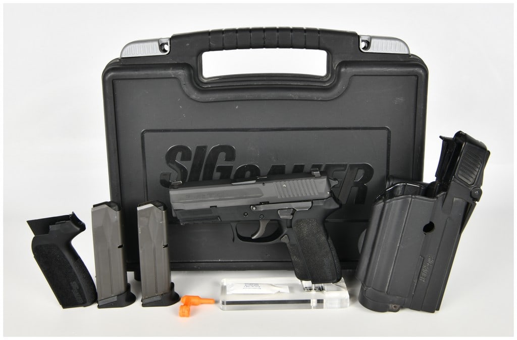 SIG Sauer SP2022 Double-Action/Single-Action Semi-Automatic Pistol 9mm Parabellum with 3.9 Inch: This lot features a SIG Sauer model SP2022 semi-automatic pistol chambered in 9mm Parabellum, utilizing a double-action/single-action (DA/SA) trigger mechanism. The firearm is constructed with a black