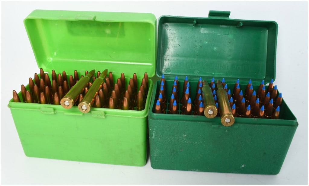 A Lot of 101 Rounds of Winchester-Western .25-06 Remington Rifle Ammunition: This lot consists of 101 rounds of .25-06 Remington centerfire rifle ammunition, contained within two green plastic flip-top storage cases. The ammunition is composed of two distinct projectile types: